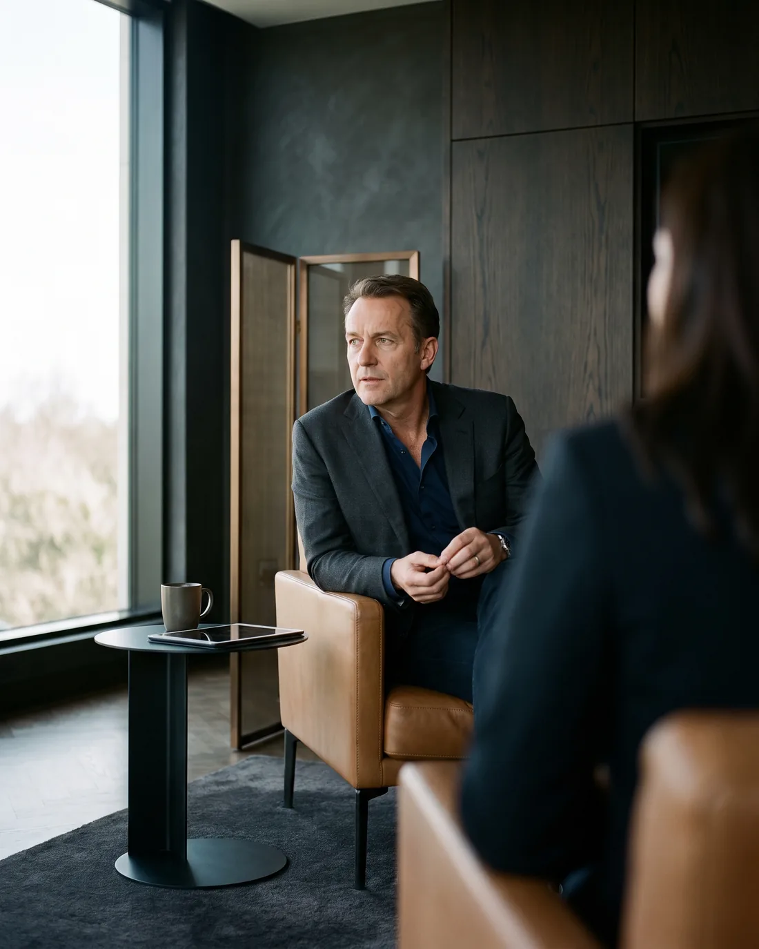 A senior CHRO reviewing the work in a calm Sydney boardroom